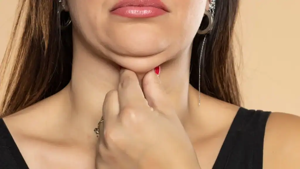 An image of a woman with double chin, sad, worried : Non Surgical Double Chin Removal Treatment in Marlborough, UK