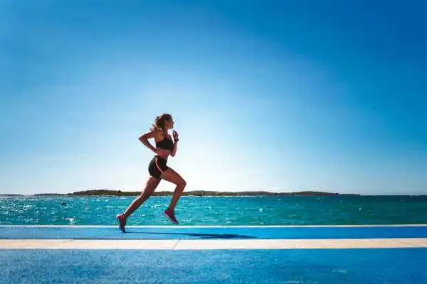 Woman running showing strong leg muscle Marlborough